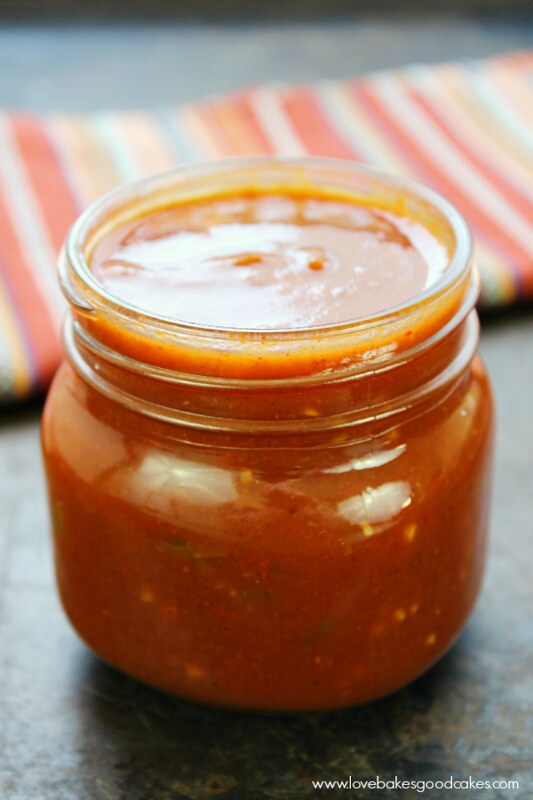 Homemade Enchilada Sauce in a glass jar close up.