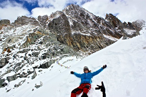 Lina making a snow angel in Cho La Pass