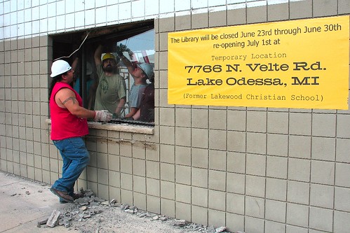 While townspeople commemorated the groundbreaking, workers were already removing windows from the building as part of the renovation.
