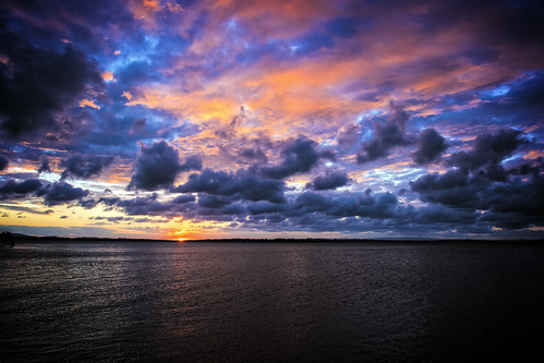 sunset sea sky water weather clouds sunsetsandsunrisesgold cloudsstormssunsetssunrises