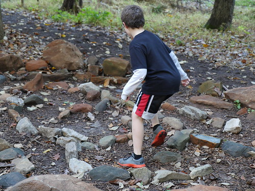 Child playing in the woods 