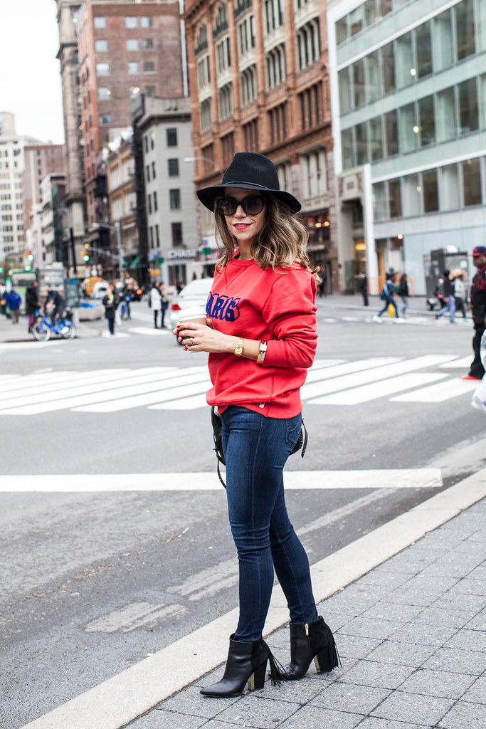 red paris sweatshirt otte nyc black hat fall outfit coach dakota bag ag skinny jeans casual outfit fringe boots sam edelman boots nordstrom sunglasses kate spade red lipstick new york fashion blogger corporate catwalk 