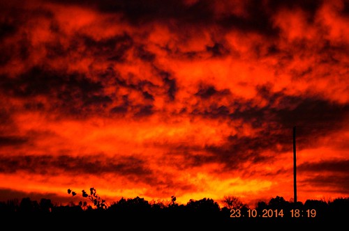sunset red clouds fire solar eclipse partial