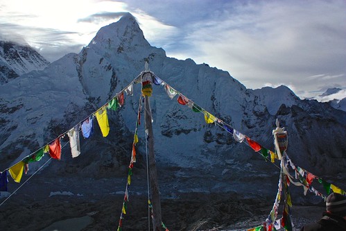 Prayer flags glow in front of Lhotse