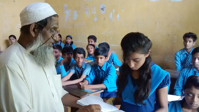Urdu teacher Ibrahim Ali with his students at school.