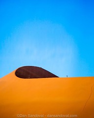 People for Scale. Sossusvlei, Namibia.  _ The little dots protruding from the top of the dune are people. The massive sand dunes, amongst the biggest in the world, are an impressive sight to see, but even moreso to walk. Climbing the sands in the morning