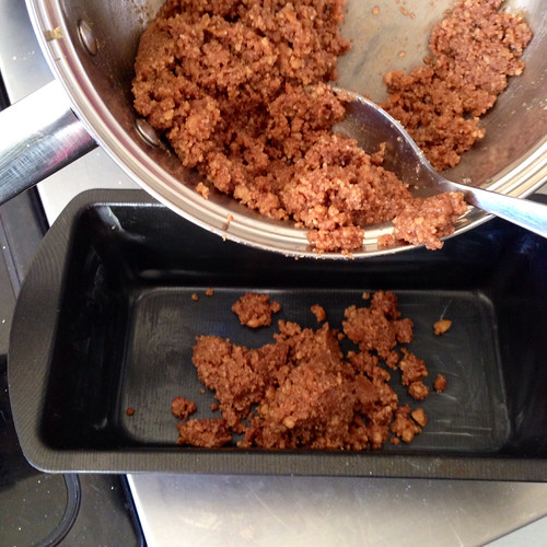 Crushed biscuits and melted butter for base of cheesecake.